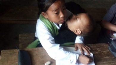Photo of Manipur: 10-Yr-Old Girl Attends Classes With Sister In Lap